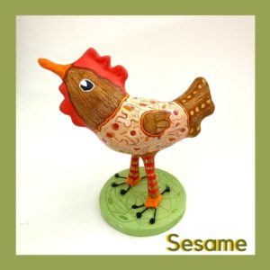 Paperclay bird sculpture painted with warm browns and reds.