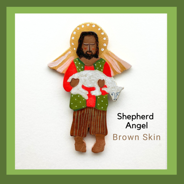 A brown skin shepherd angel holding a small sheep. He is wearing bright red shirt and a green vest and brown stripped paints.