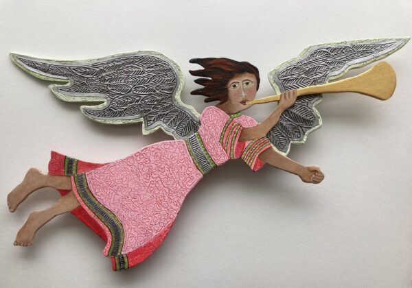Red and pink wood flying angel on a pole with a base. Decorative sculpture. This angel is flying from left to right.