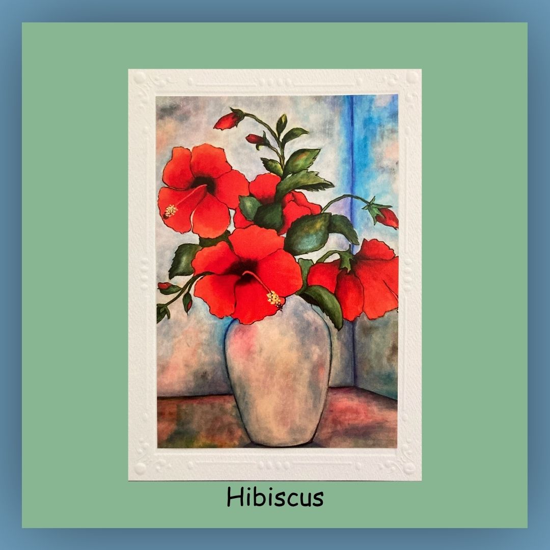 5 x 7 greeting card. Red Hibiscus flowers in a white vase on the outside of the card. Inside of card is blank.